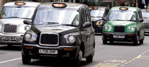 A fleet of taxi's on the road