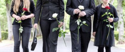 Grieving family walking to a funeral of a love one who passed away