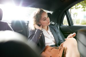 Passenger sitting in the back of a car