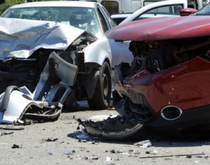 A car crash as a result of careless driving leaving two cars extremely damaged