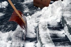 Stairs getting cleared of ice and snow