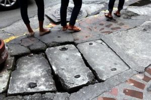  Pavement that is cracked into three chunks.