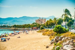 A beach holiday with a castle in the background