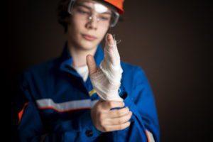 Injured worker with bandaged left hand