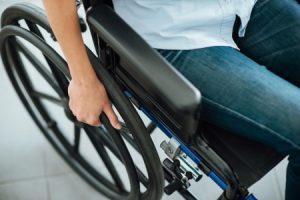 Man moving his wheelchair after an accident