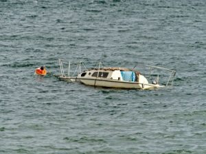 A boat accident out on the sea causing the boat to sink