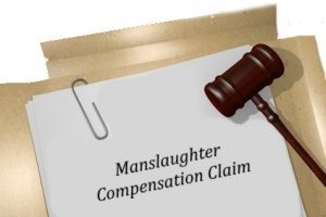 Gavel over a piece of paper saying manslaughter compensation claim