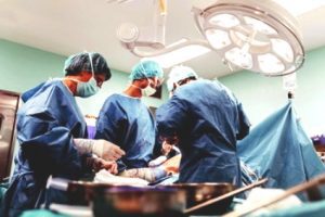 A group of surgeons operating on a patient