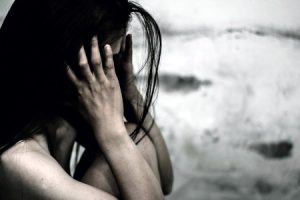 A young girl sitting out in the open after escaping her babysitter