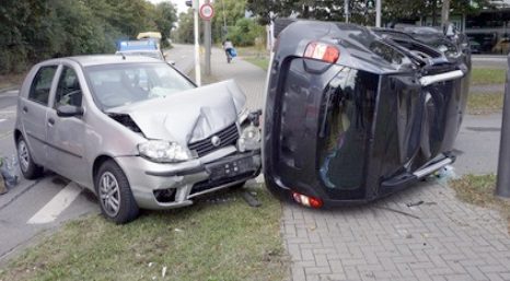 Two damaged cars involved in a collision with each other