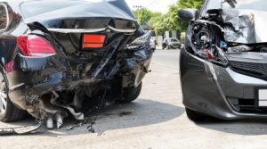 Two cars heavily damaged from a collision