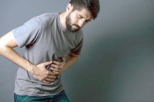 Man holding his bruised ribs