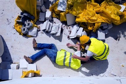 Man who fell off a scaffolding being helped by a co-worker
