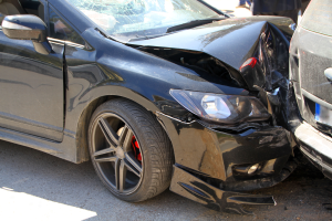 Car crashing into another car in a head on collision