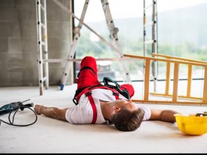 Man who has fallen off a ladder while working