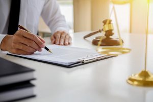 A criminal injury claim solicitor reviewing paperwork