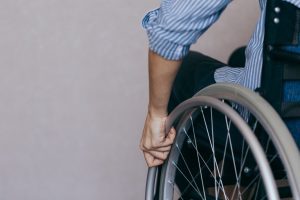 Man who is paralysed from the waist down moving his wheelchair