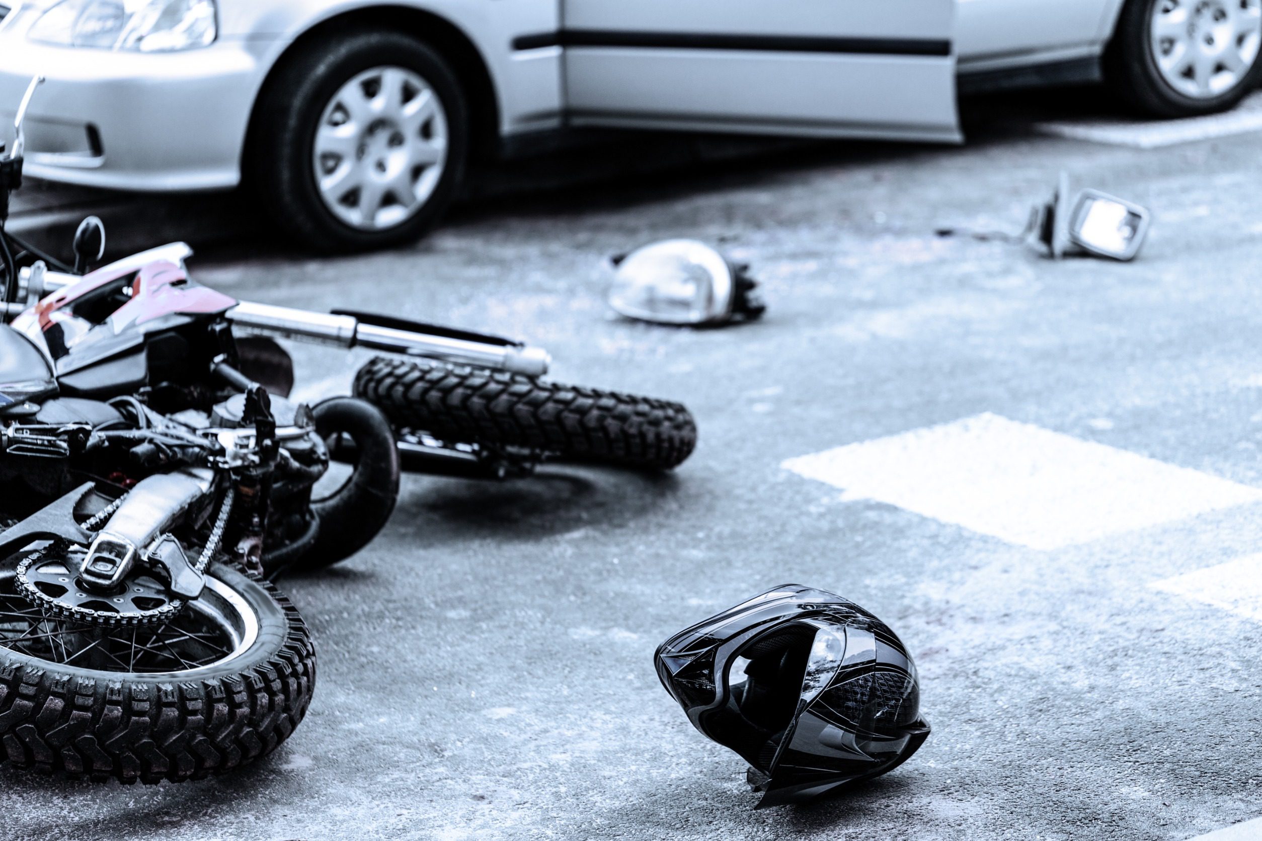 Damaged Items From A Motorcycle Crash In The Road. 