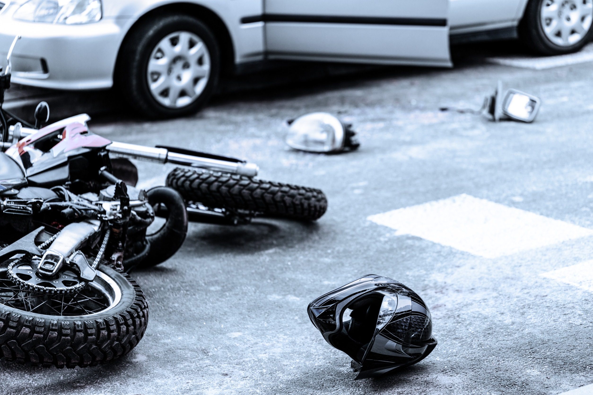 Damaged Items From A Motorcycle Crash In The Road. 