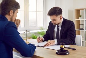 A solicitor discussing with his client how to claim for logistics accidents