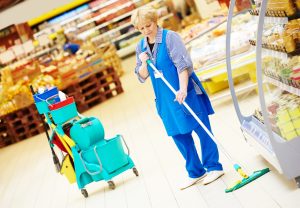 A Cleaner Mops A Supermarket Floor Without Wet Floor Warning Signs. 