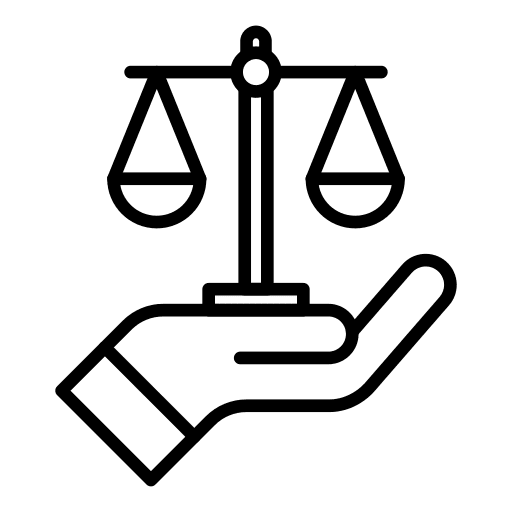 a hand holding the scales of justice