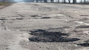 A close-up image of a pothole. 
