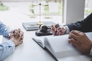 A solicitor discussing special damages for cycling accident claims with their client.