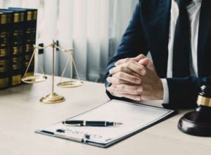 A No Win No Fee solicitor prepares to answer the question, 'Who is responsible for reporting hazards and accidents in the workplace?'.