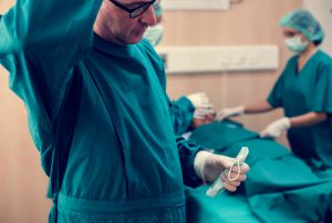 Surgeons getting reading to carry out procedure in theatre