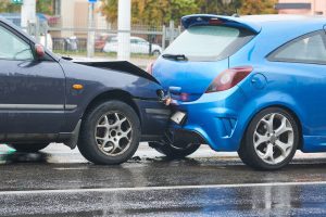 An image shows a rear end car crash in which someone could sustain nerve injuries.