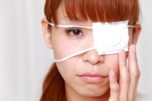 A woman wears an eyepatch
