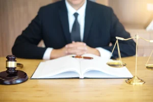 Loss of amenity solicitor with hands clasped in front.