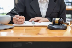 A solicitor takes notes while explaining loss of amenity to a client